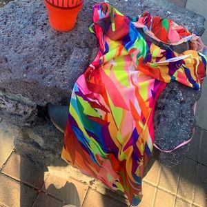 Colorful tight fitting dress with open sides and back